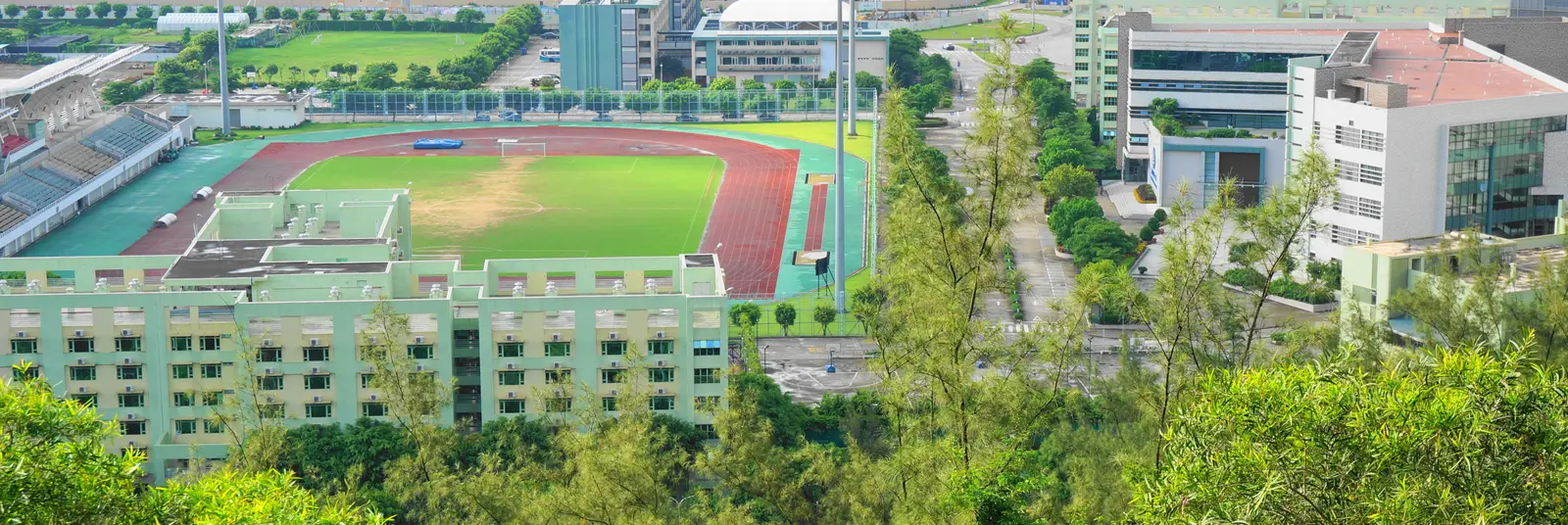 Aerial view of the library and stadium at Macau University of Science and Technology