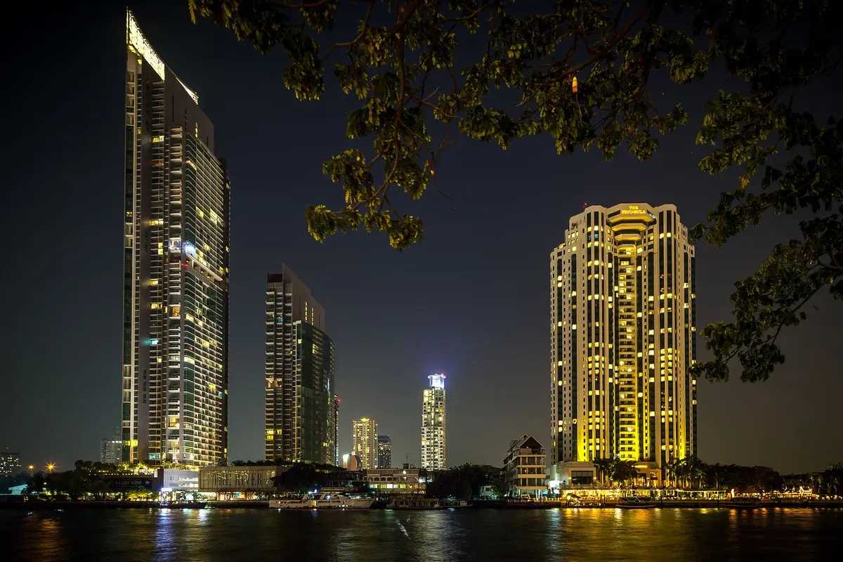 High-rise hotels and residential towers on the bank of the Chao Phraya River in Bangkok at night